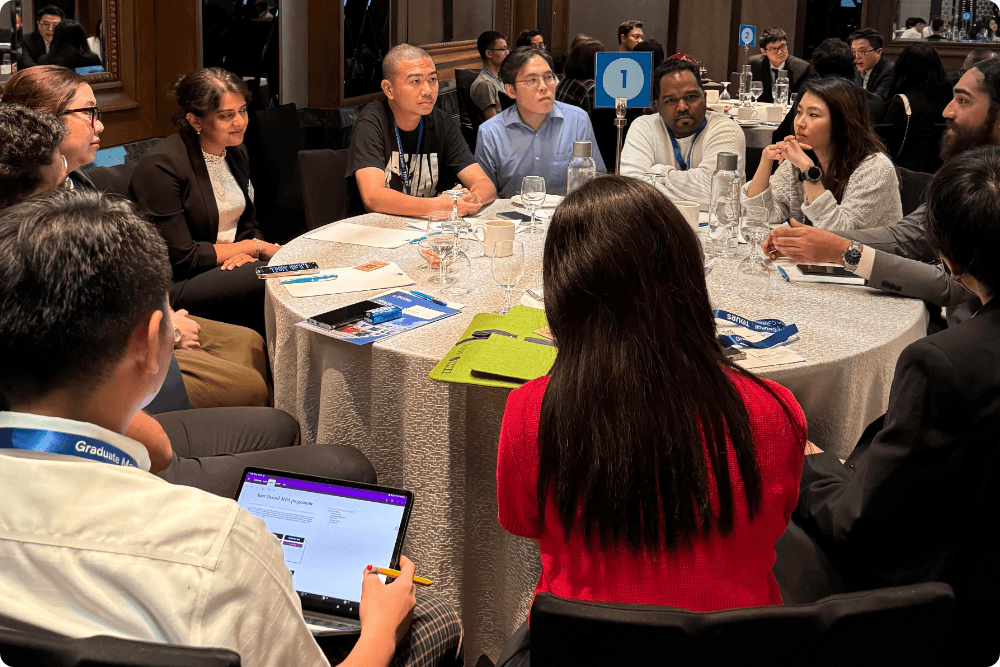 Round table networking with a school representative and MBA candidates