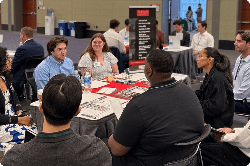 Three Boston University admissions representatives talking to five candidates during MeetUps.