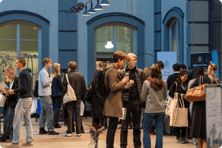 Group of people have a conversation at a networking fair
